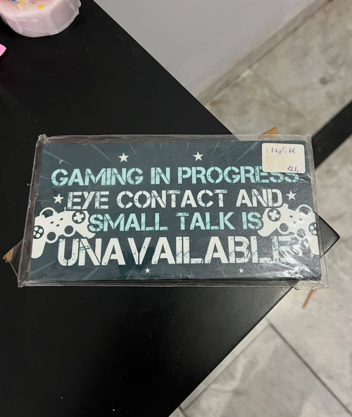 "Gaming in Progress" Sign Hanging