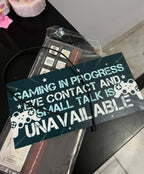 "Gaming in Progress" Sign Hanging